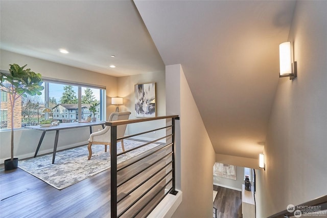 corridor with recessed lighting, baseboards, and wood finished floors