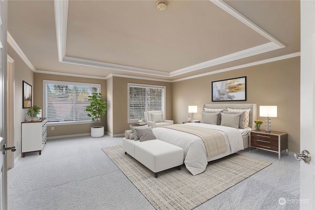 bedroom featuring a tray ceiling, ornamental molding, and light carpet