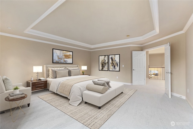 bedroom with crown molding, light colored carpet, and a tray ceiling