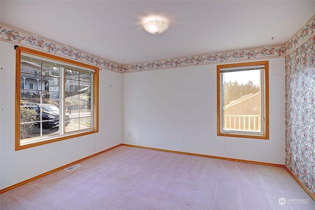 unfurnished room featuring carpet flooring