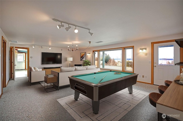 game room featuring pool table, light carpet, and a chandelier