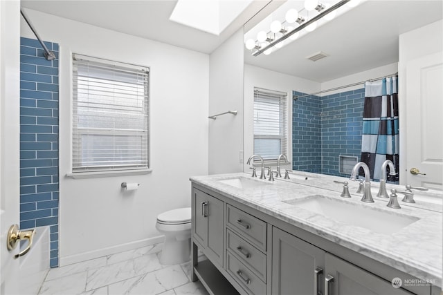 full bathroom with toilet, vanity, a skylight, and shower / bathtub combination with curtain