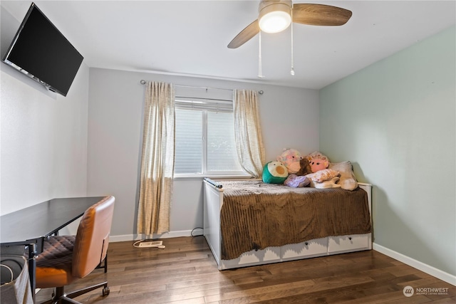 bedroom with ceiling fan and dark wood-type flooring