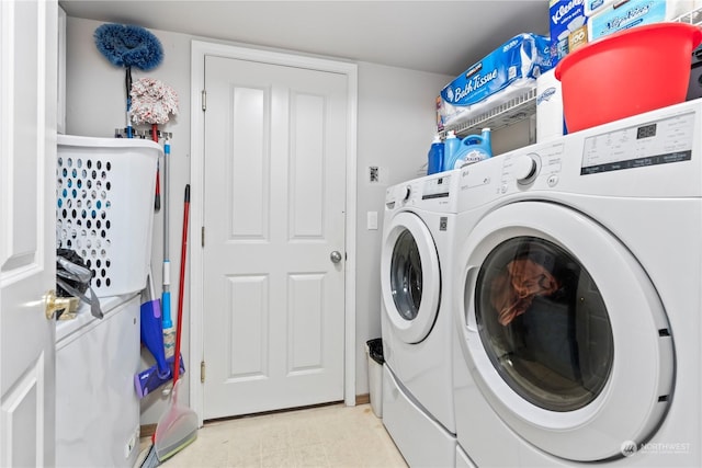 laundry room featuring washing machine and clothes dryer