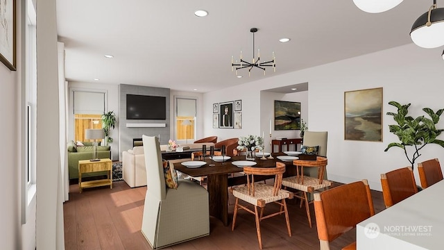 dining space featuring a notable chandelier and light hardwood / wood-style flooring