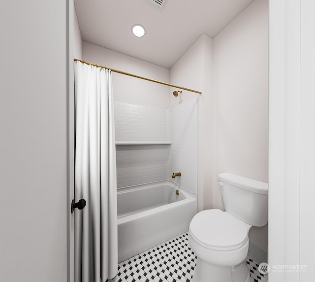 bathroom featuring toilet and shower / tub combo with curtain