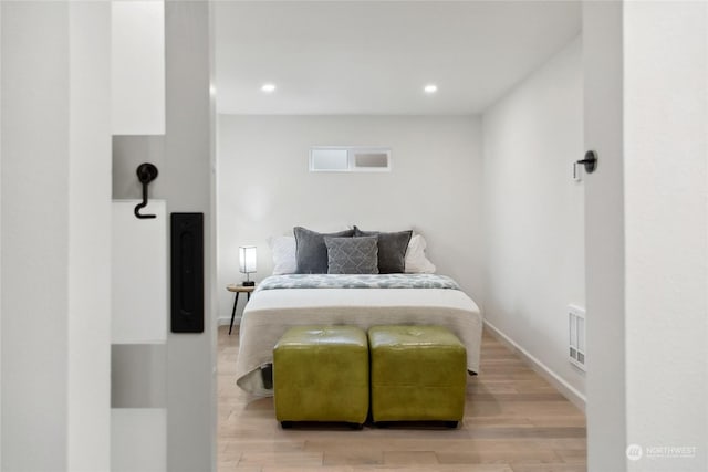 bedroom with light wood-type flooring