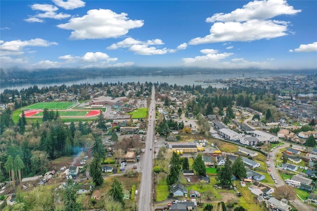 birds eye view of property with a water view