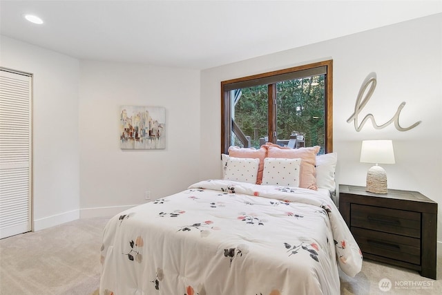 carpeted bedroom featuring a closet