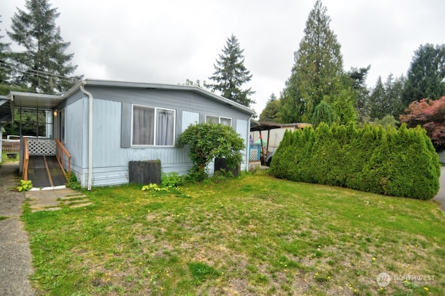 view of home's exterior with a lawn