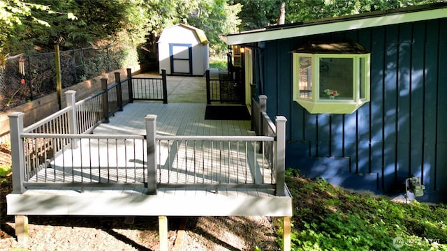 895 Wildwood Blvd SW, Issaquah, WA 98027 - wooden terrace with a storage shed, fence, and an outdoor structure