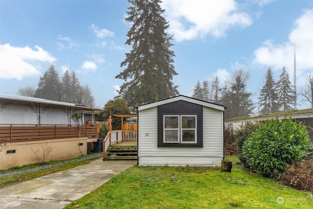 view of outdoor structure with a lawn