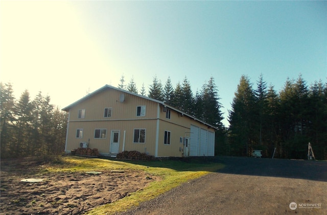 view of side of property with a yard