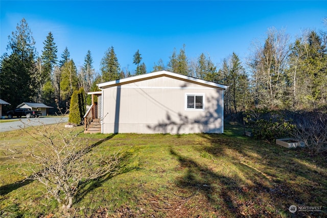 view of property exterior featuring a lawn