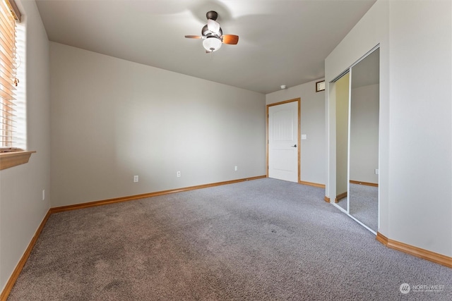 unfurnished bedroom featuring ceiling fan, carpet, and a closet