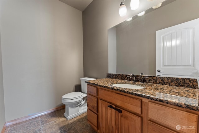 bathroom with toilet and vanity