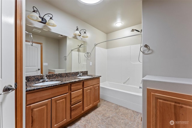 bathroom with vanity and shower / tub combination