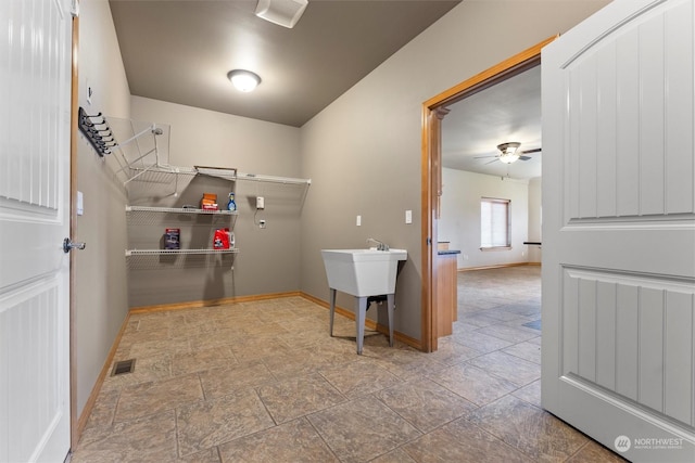 laundry room featuring ceiling fan