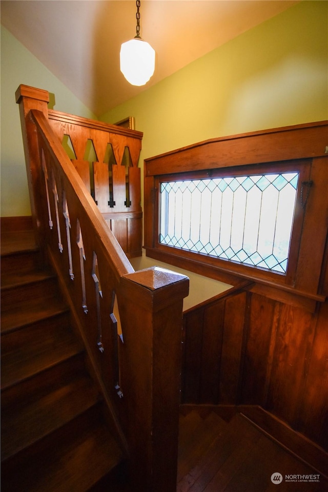 staircase with hardwood / wood-style flooring