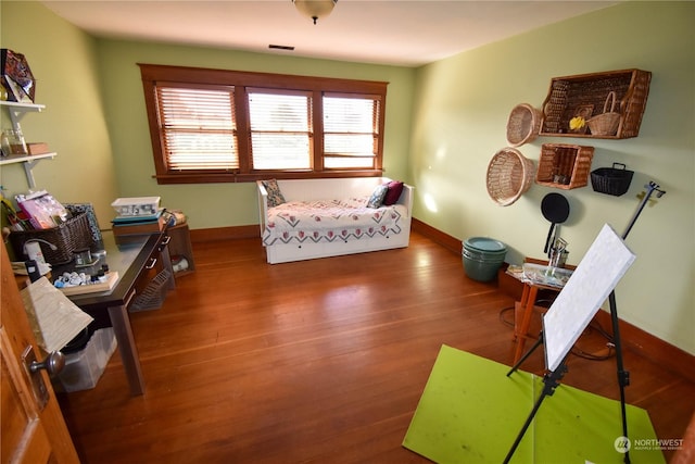 bedroom featuring dark wood-type flooring