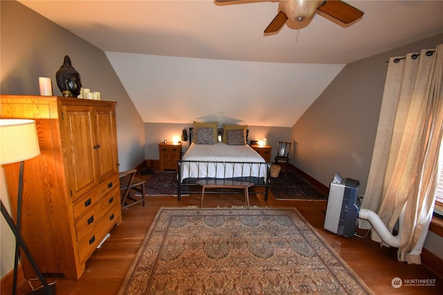 bedroom featuring lofted ceiling, ceiling fan, and dark hardwood / wood-style flooring