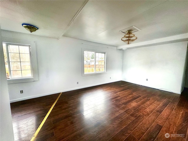 empty room featuring dark hardwood / wood-style flooring