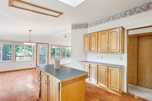 kitchen featuring a kitchen island, light brown cabinetry, lofted ceiling with beams, hanging light fixtures, and light hardwood / wood-style flooring