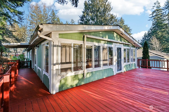 wooden terrace with a sunroom