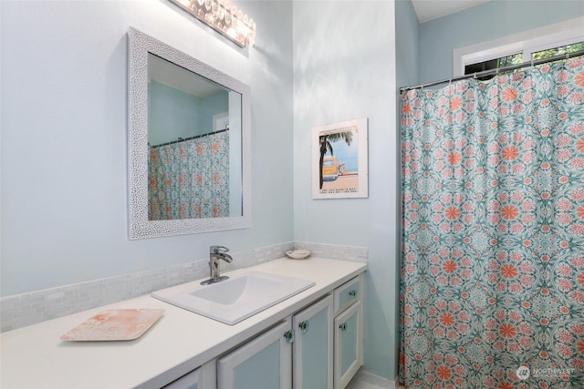 bathroom featuring vanity and a shower with curtain