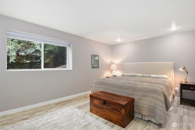 bedroom with light hardwood / wood-style flooring