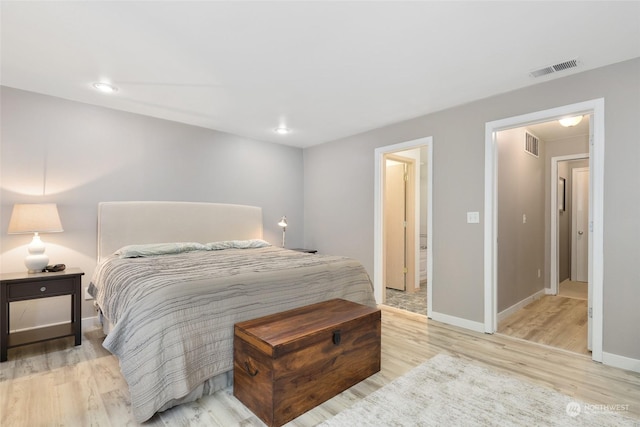 bedroom with light hardwood / wood-style floors