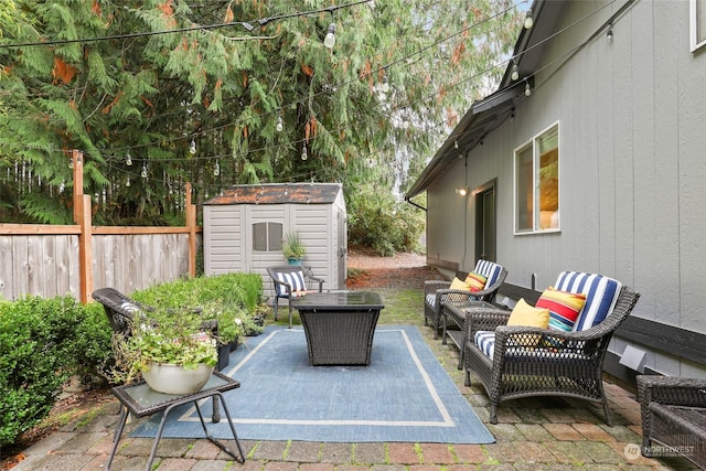 view of patio with a storage unit and outdoor lounge area