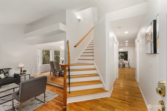 stairway with hardwood / wood-style floors