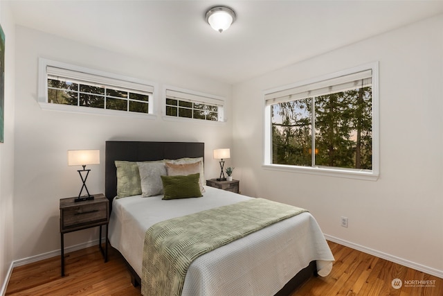 bedroom with hardwood / wood-style floors