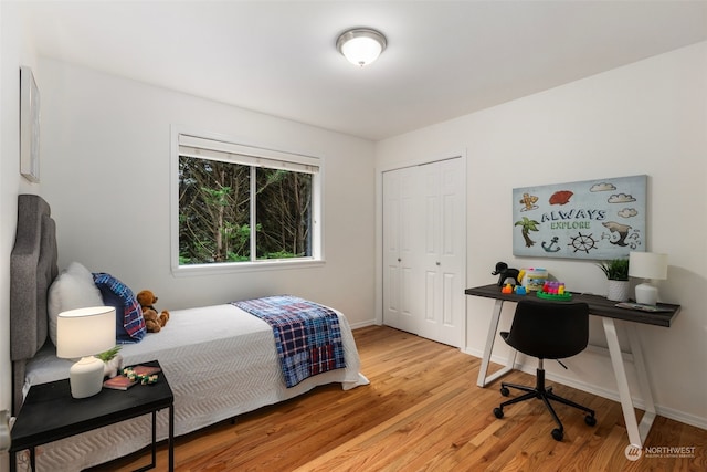 bedroom featuring light hardwood / wood-style floors and a closet