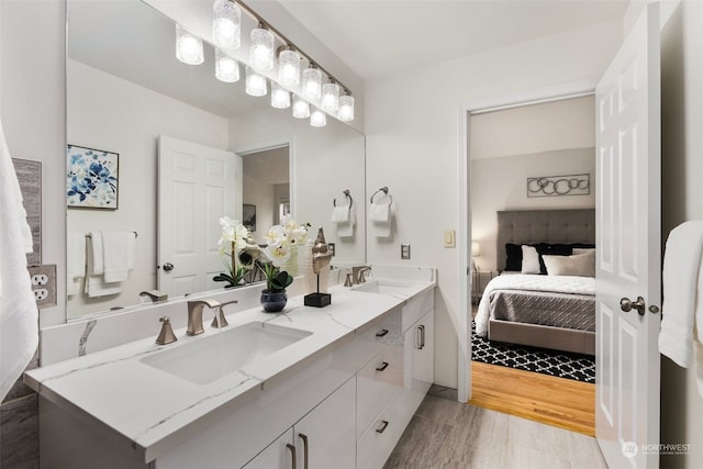 bathroom featuring vanity and hardwood / wood-style floors