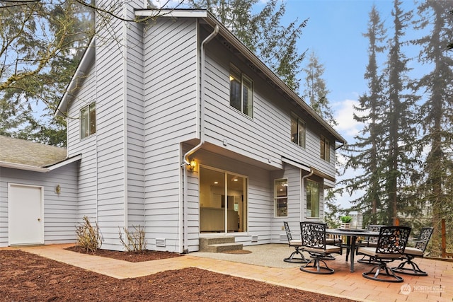 rear view of house with a patio