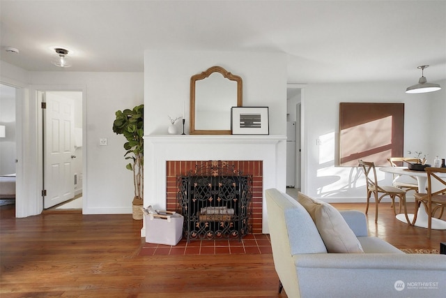 living room featuring a fireplace and dark hardwood / wood-style floors