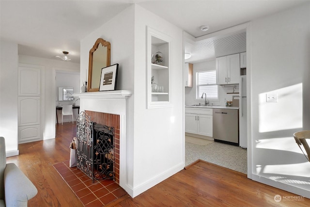 interior space featuring sink, dark hardwood / wood-style floors, and built in shelves