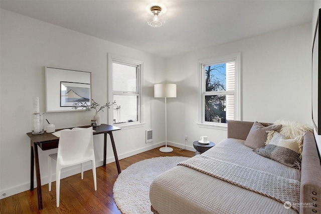 bedroom featuring dark hardwood / wood-style flooring