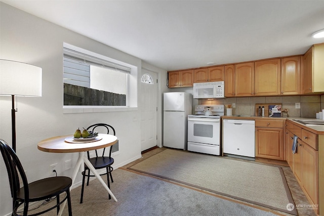 kitchen featuring white appliances and decorative backsplash