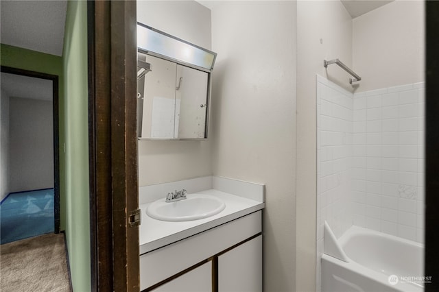 bathroom featuring shower / bathing tub combination and vanity