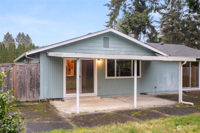 back of property featuring a patio area