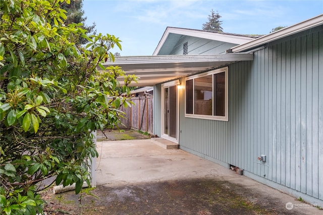 view of side of home with a patio