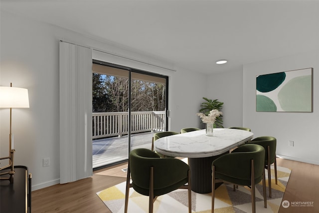 dining area with light hardwood / wood-style flooring