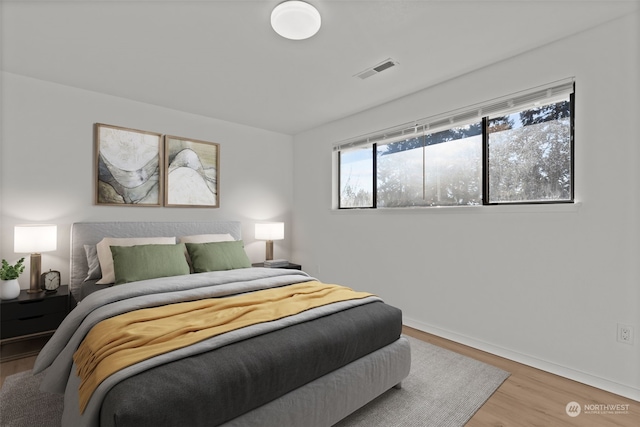 bedroom with wood-type flooring