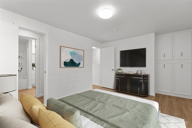 bedroom with light wood-type flooring