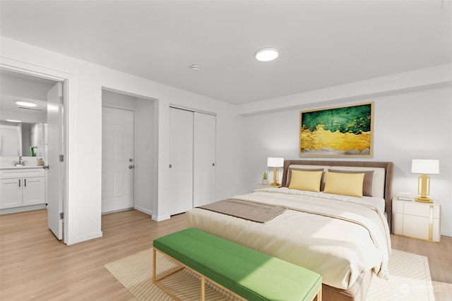 bedroom featuring sink, light hardwood / wood-style floors, and connected bathroom