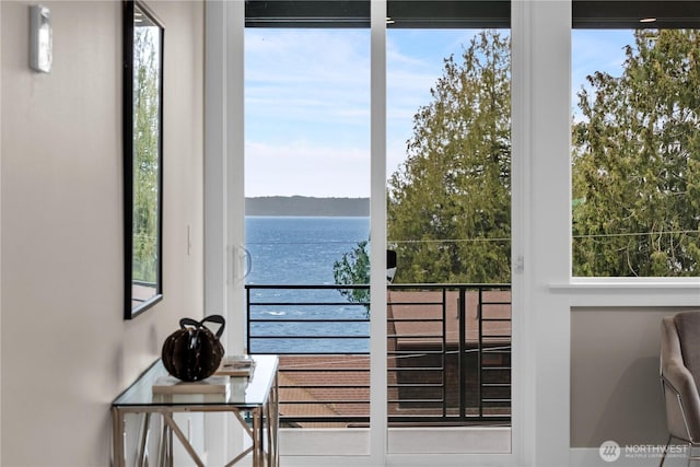 doorway to outside featuring a water view