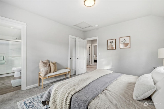 bedroom featuring light colored carpet and ensuite bathroom